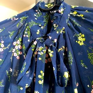 Flowered flowy tie neck blouse